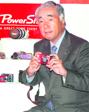Canon India president and CEO Kensaku Konishi poses with a digital camera in New Delhi on Tuesday. Canon launched a range of 20 digital cameras and DV camcoders in the Indian market.