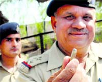 A cop shows the cartridge that was found in front of the main entrance of DAV College, Sector 10, after the firing incident there. Tribune photo: Manoj Mahajan