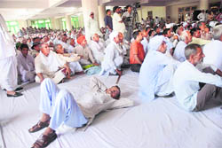 A khap member takes a nap during the Mahapanchayat in Kurukshetra 