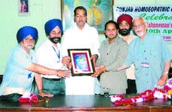 Dr Yogender Paul Sharma being honoured with Homoeopath of the Year 2009 award.