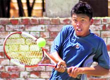 A player returns a shot during the AITA Tennis Tournament at the CLTA courts, Sector 10, Chandigarh, on Wednesday. Tribune photo: S Chandan