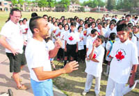 Actor Rahul Bose talks to students from various schools participating in a marathon on 