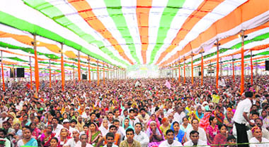 Followers of Satpal Maharaj listen to his sermon in Haridwar
