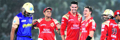 Royal Challengers Bangalores players celebrate the wicket of Yusuf Pathan on Wednesday.