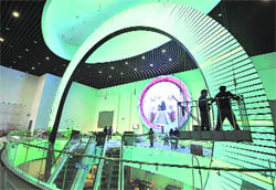 Employees work inside the China Railway Pavilion at the Shanghai World Expo site on Thursday. The Shanghai World Expo 2010 is due to run from May 1-October 31, with about 70 million visitors expected to attend, according to its official website