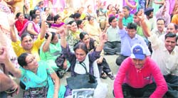 Government school teachers protest in Sector 19, Chandigarh, on Thursday.