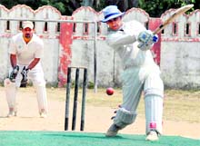 A batsman hits the ball during a match of the Centre Government Employee Welfare Coordination Committee Cricket Tournament in Dehradun on Thursday. A Tribune photograph