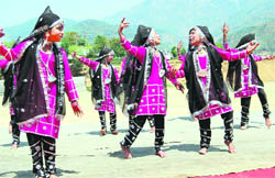 Students present a dance on the occasion of Himachal Day at Dharamsala