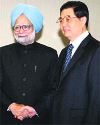 Prime Minister Manmohan Singh and Chinese President Hu Jintao greet each other during an official welcome ceremony in Brasilia