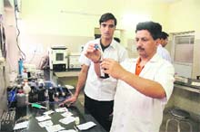 Lab technicians at work in Jammus Gandhi Nagar Government Hospital.They resumed duties on Thursday after the suspension of the government employees strike