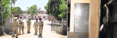(Left) Police personnel keep vigil at the Aggar Nagar division of the PSEB in the wake of two-day strike, in Ludhiana on Thursday; (Right) Most offices of the PSEB divisions and sub-divisions remained locked due to the two-day strike by employees.