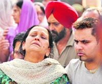 Devastated mother of Priya being consoled by relatives in Ludhiana on Thursday.
