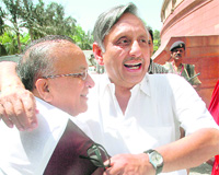 Union Minister S Jaipal Reddy greets Mani Shankar Aiyar in Parliament.