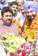Workers of the BJP welcome party national secretary Navjot Singh Sidhu at the Punjab BJP headquarters in Chandiagrh on Thursday.