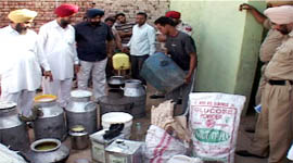 The officials of dairy and health department along with the local police during a raid at Tota Singh Wala village in Dharamkot area of Moga.