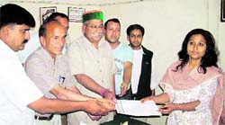 Congress members, along with MLA Jot Singh Gunsola, present a memorandum to the SDM in Mussoorie on Friday. 