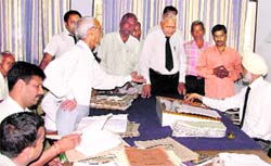 Labour courts presiding officer GS Gill hears litigants and lawyers during the Lok Adalat in Ludhiana 