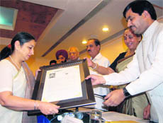Jyotsna Brar, Principal of Welham Girls' School receives the Pride of Uttarakhand award from  Governor Margaret Alva and BJP leader Shah Nawaz Hussain in Dehradun on Saturday.