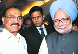 Prime Minister Manmohan Singh with The Tribune Editor-in-Chief Raj Chengappa on board Air India One.