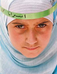 A Jordanian girl takes part in a protest in Amman