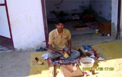 Suresh Kumar at work in his shop. Tribune photo