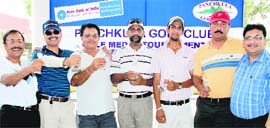 Winners of the Golf Medal Tournament with their trophies at the Panchkula Golf Club on Sunday. 