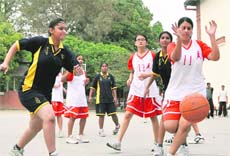 A match in the District Under-18 Basketball Tournament in progress in Dehradun on Sunday. 