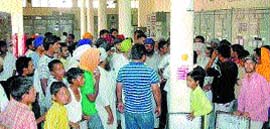 Villagers storm into the PSEB office in Jamshed village to protest against careless working of the board. Photo by Ashok Kaura 