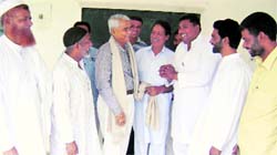 Punjab Waqf Board chairman Azhar Alam shares a point with office-bearers of Muslim organisations at Ahmedgarh on Sunday. Photo: Mahesh Sharma 