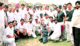 Ludhiana Media XI players pose with MP Manish Tewari and MLA Jasbir Singh Jassi Khangura in Ludhiana on Sunday. A Tribune photograph