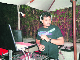 DJ Leon mix notes at Zinc Lounge on Saturday night. 