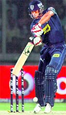 Andrew Symonds plays a shot at Firozshah Kotla in New Delhi on Sunday.  PTI