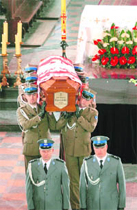 Soldiers carry the coffins of President Lech Kaczynski and his wife Maria through the Cathedral of St. John in Warsaw on Sunday. 