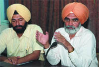 Darbara Singh Guru, principal secretary to the Chief Minister, speaking to media in Bathinda on Monday. Also seen in the picture is Deputy Commissioner Gurkirat Kirpal Singh.