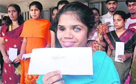 Students in a jubilant mood after recieving scholarships at a function in Panjab University, Chandigarh, on Monday.