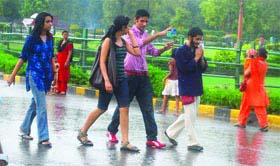 Youngsters enjoy the sudden rain in New Delhi