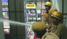 Fire fighters douse the flames at Central Market