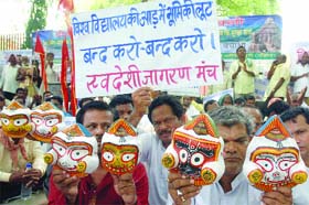 Activists of the Swadeshi Jagaran Manch protest against illegal grabbing of land in the name of Vedanta University in Orissa, at Jantar Mantar in New Delhi