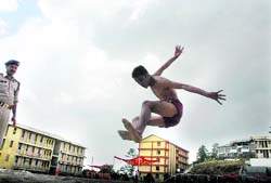 A boy participating in a high jump competition, part of police recruitment drive, organised by the Himachal police at Shimla on Monday. A Tribune photo