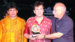 Madhusudan Barman and Gopal Barman being honoured during a function at Virsa Vihar in Amritsar.