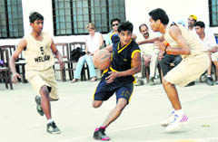 Matches being played in the District Junior Basketball Championship in Dehradun on Tuesday. 