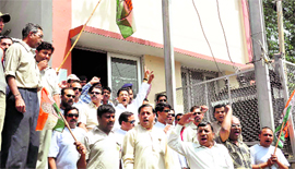 Congress workers protest at a substation in Dehradun on Tuesday.