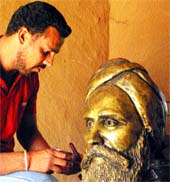 Harminder gives final touches to the sculpture of Ghadarite Baba Munsha Singh