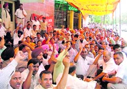 BSNL employees protest outside the GMs office following a call for a nationwide strike in Ludhiana on Tuesday.
