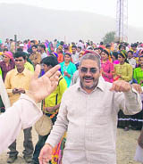 Devotees dance with the doli of a local diety at the Jakhdar Bissu mela at Jaunpur Block near Mussoorie.