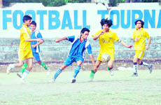 A match of the RB Singh Memorial Football Tournament being played in Dehradun on Wednesday. 