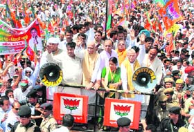 Senior leaders of the BJP Sushma Swaraj, LK Advani, Nitin Gadkari atop a truck as they lead a rally to Parliament in protest against price hike in New Delhi