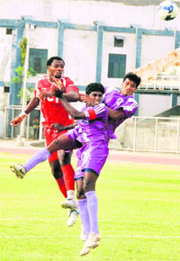 JCT FC and Chirag Uniteds players vie for the ball in Ludhiana on Wednesday.