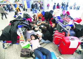 Passengers stranded at an airport in Frankfurt, Germany