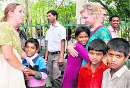 American tourists meet rag-picker children in front of the Gandhi Park in Dehradun. Tribune photo: Vinod Pundir